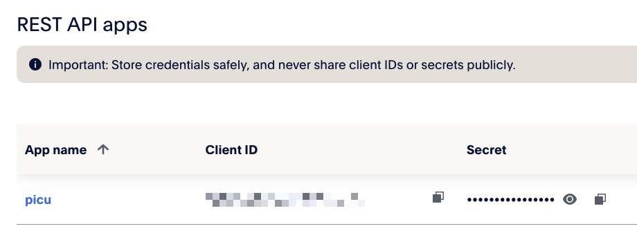 Screenshot of the "REST API apps" table, with one app named "picu" listed; There are UI elements to copy the "Client ID" and the "Secret" to the clipboard